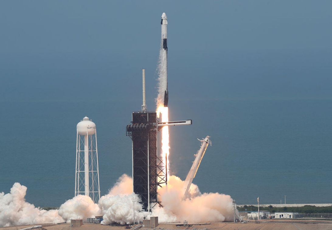 The SpaceX Falcon 9 rocket with the manned Crew Dragon spacecraft attached takes off from launch pad 39A at the Kennedy Space Center.