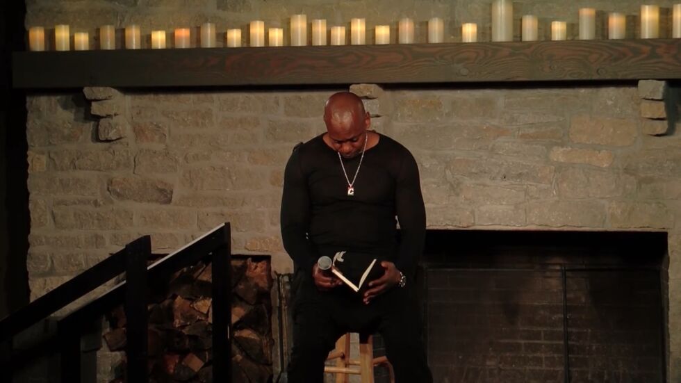 Chappelle checking his reference notes.
